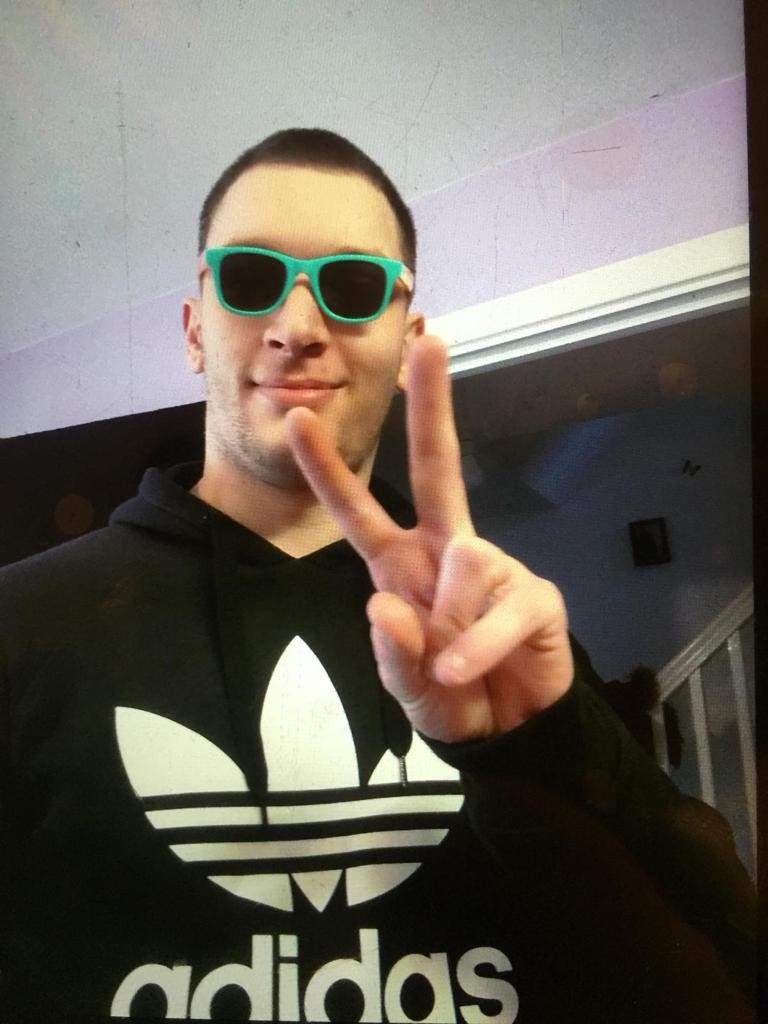 Photo of Mark Culverhouse. He is smiling at the camera wearing sunglasses.