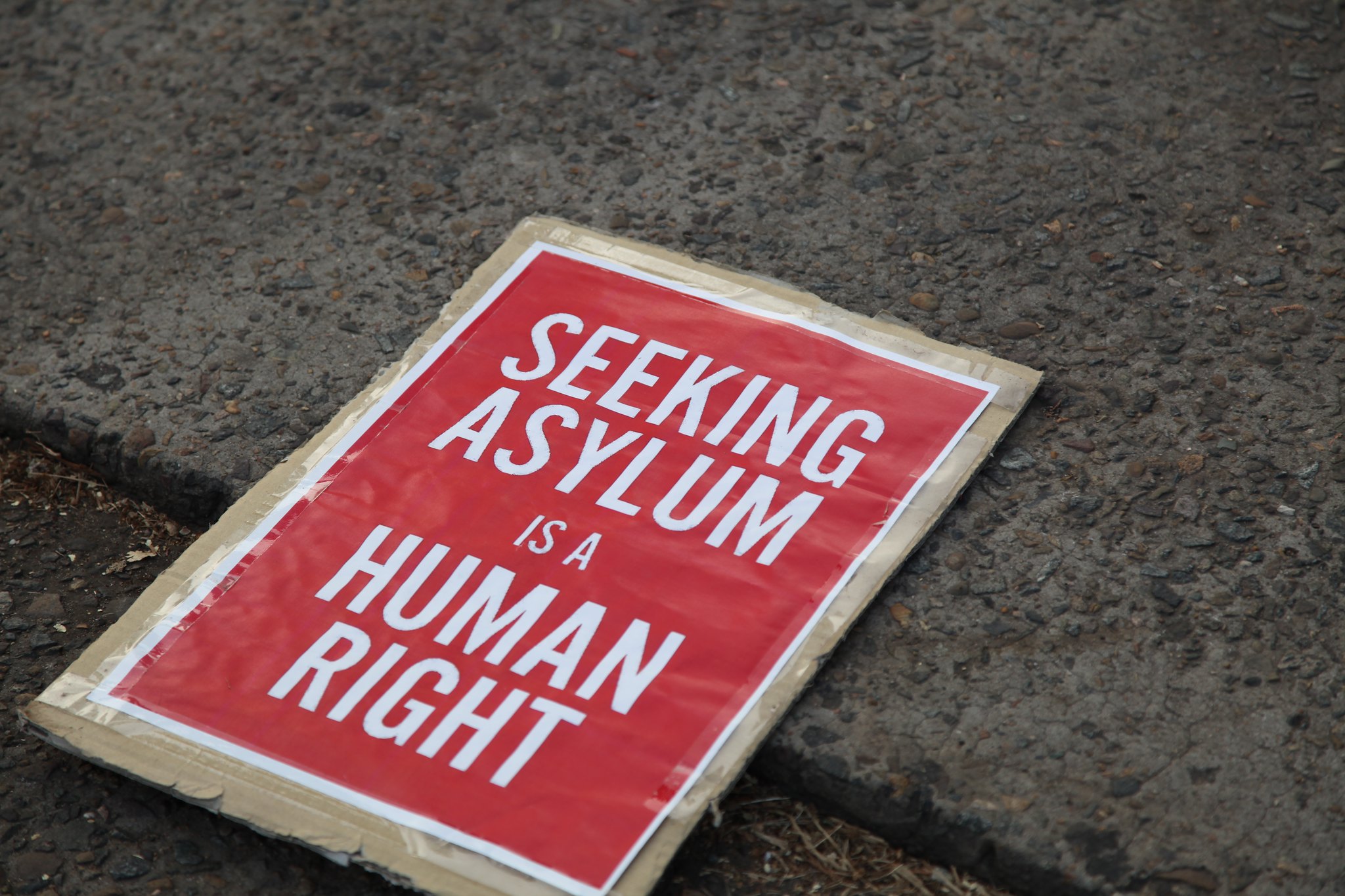 Image of a banner reading 'Seeking Asylum is a Human Right'